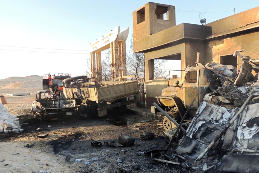 The site of an attack in which 21 border guards where killed in al-Wadi al-Gadid, close to the El-Farafrah oasis, in the western desert, some 630 kms west of Cairo, near the frontier with Libya. Photo: AFP