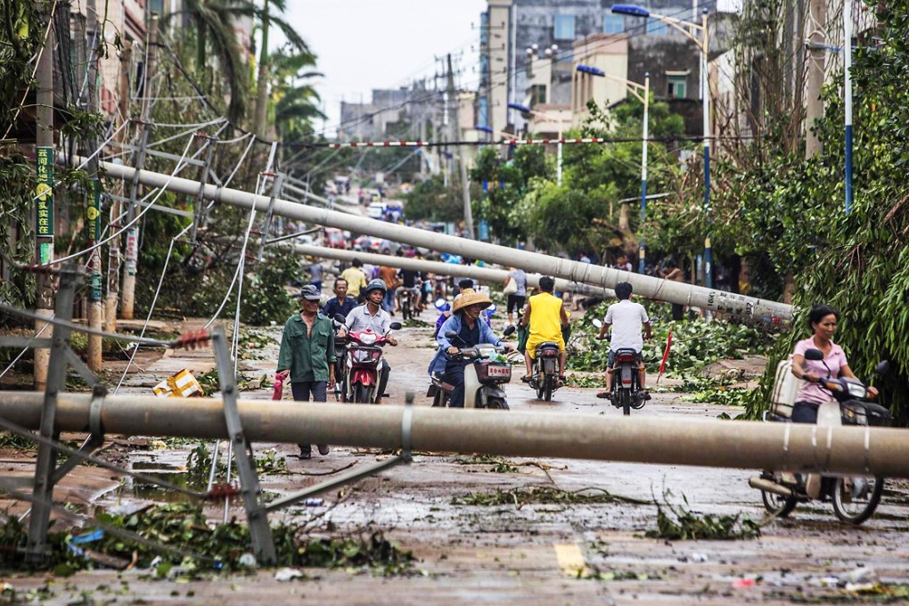 After making landfall in Hainan province, Typhoon Rammasun moved onto Guangdong, where it forced evacuations and downed electricity lines, including in Leizhou (above). Photo: Reuters