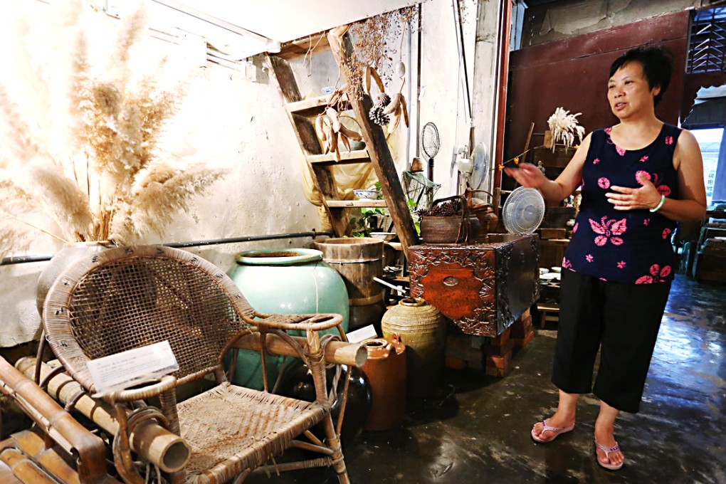 Wong Wai-king with some of the exhibits at her Tai O Cultural Workshop. She hopes they will stay in the village. Photo: Nora Tam