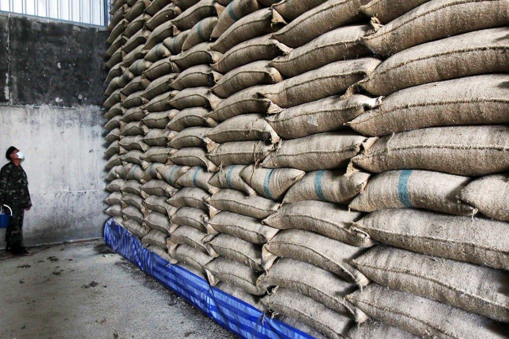 A soldier checks sacks of rice at a warehouse in Ayutthaya province, north of Bangkok. Photo: Reuters