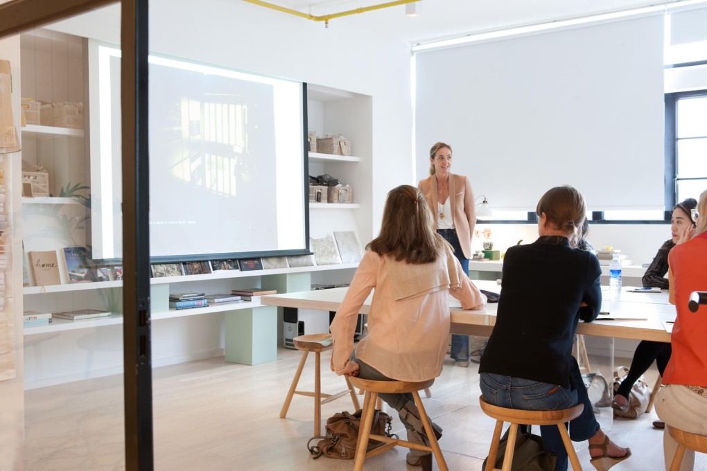 Insight School of Interior Design's Eve Mercier shows students Gary Chang's flat. Photo: SCMP
