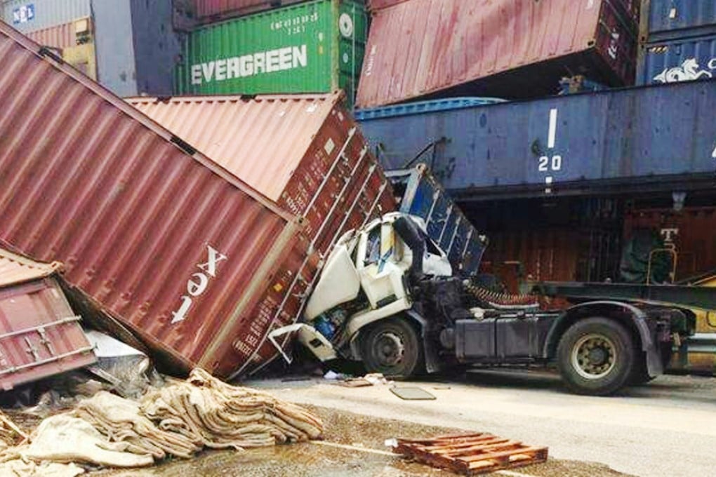 Five containers fell to the ground at the Kwai Chung container terminal at lunchtime on Tuesday, one crushing the truck. Photo: RTHK