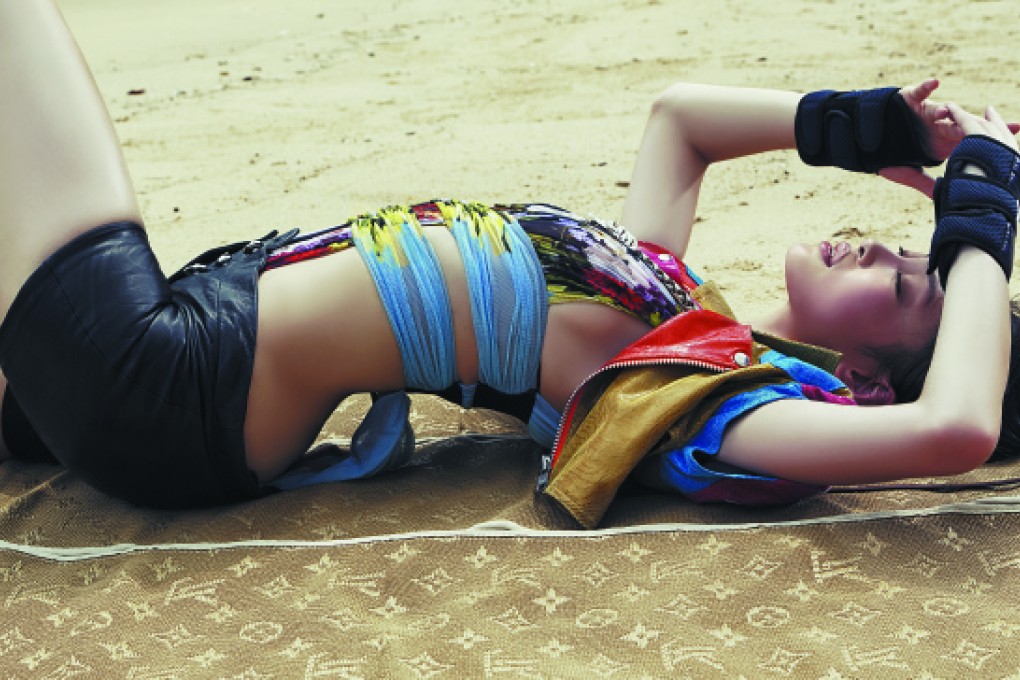 Swimsuit and leather shorts (HK$14,800) by Versace (inquiries: 2918 1008). Biker jacket (HK$6,000) from Adidas Originals by Jeremy Scott. Gloves, stylist's own. Beach mat (HK$24,500) by Louis Vuitton.
