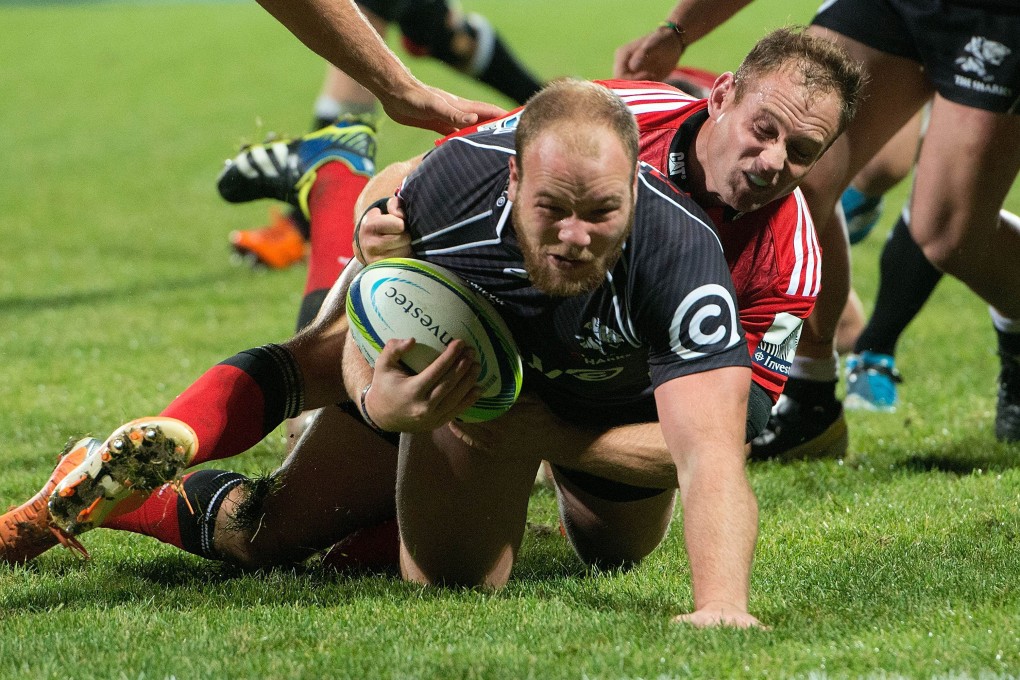 Kyle Cooper of the Sharks scores despite the attention of Crusaders' scrum-half Andy Ellis during their clash in May. The Crusaders turned in a poor performance on that occasion, but expect to turn the tide in their Super 15 semi-final. Photo: AFP
