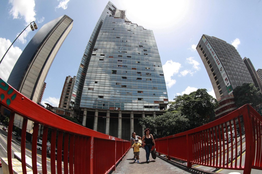 The tower rises in the background. Photo: AFP