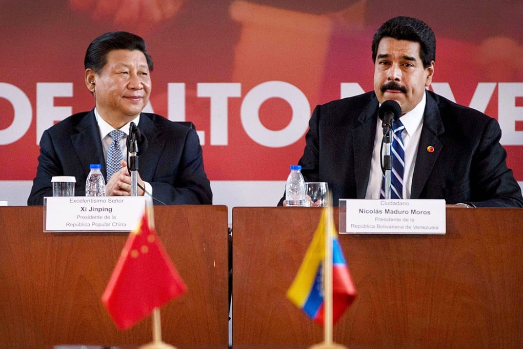 Venezuela's President Nicolas Maduro meets Xi Jinping during the signing of several cooperation agreements between the two nations in Caracas. Photo: AP