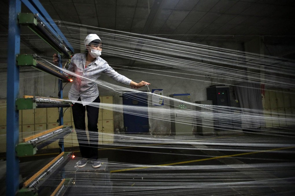 A textile worker in Wuhan, Hubei province. Chinese factory activity expanded at its fastest pace since January last year. Photo: Reuters