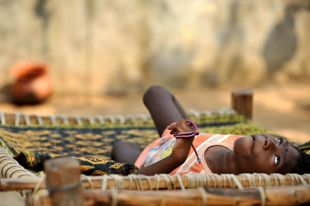 A child with cerebral palsy near the Jadugora plant. Photo: AFP