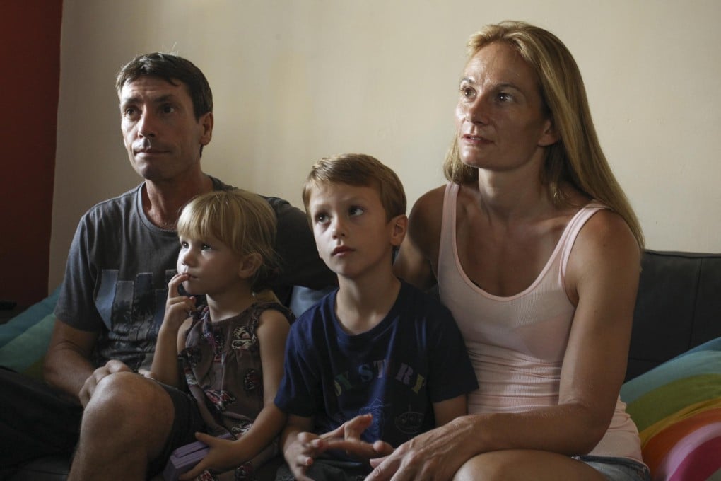 Steven and Justine Clark, with their son, Michael, and daughter, Amber. Photos: Dickson Lee; AFP