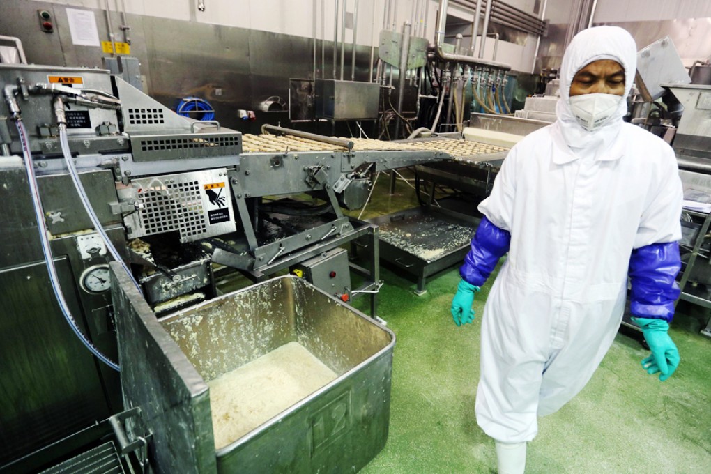 Shanghai city officials have shut a Shanghai Husi factory of US food provider OSI Group for selling out-of-date meat to restaurant giants including McDonald's and KFC, authorities said on July 21 in China's latest food safety scandal. Photo: AFP