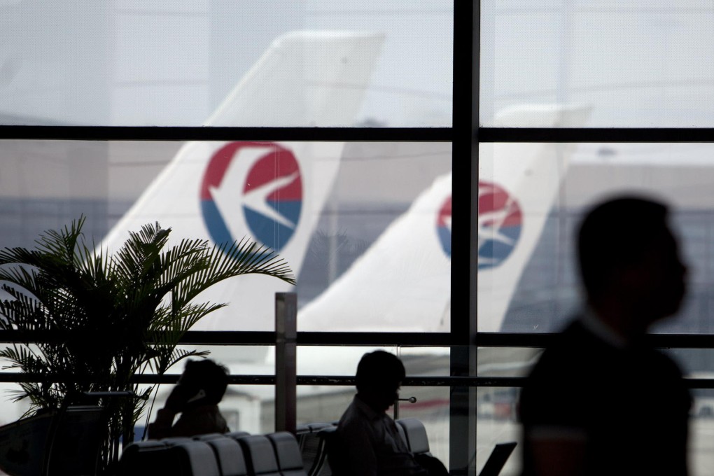 Mainland airlines including China Eastern, which have warned of sharp profit falls for the first half, may face further pressure from expected cuts in services. Photo: Bloomberg