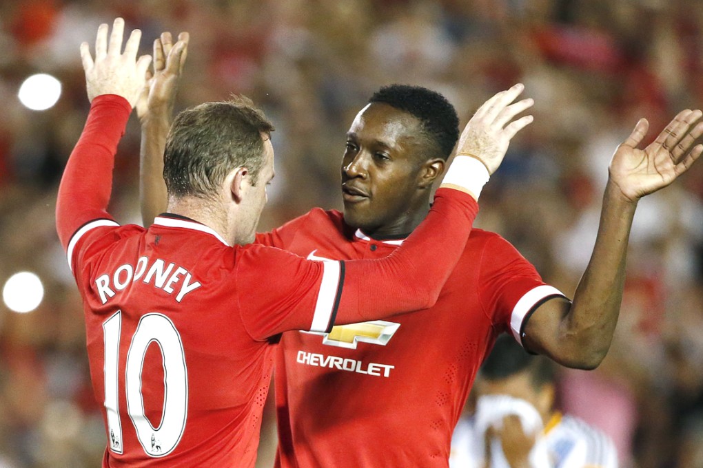 Manchester United forwards Wayne Rooney and Danny Welbeck celebrate after Rooney scored their second goal against Los Angeles Galaxy. Photo: Reuters