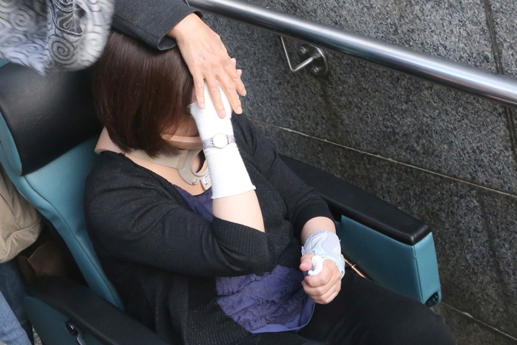 Au Wai-chun enters court in a wheelchair. Photo: David Wong