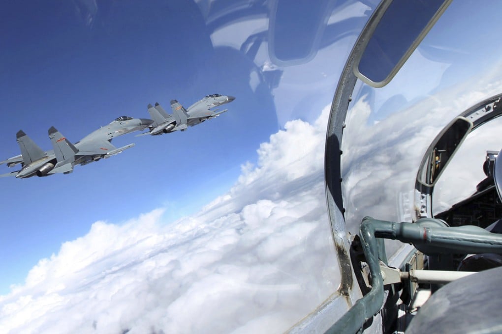 China's third-generation fighter planes of the Chengdu Military Zone take part in a training with live ammunition. Photo: Xinhua