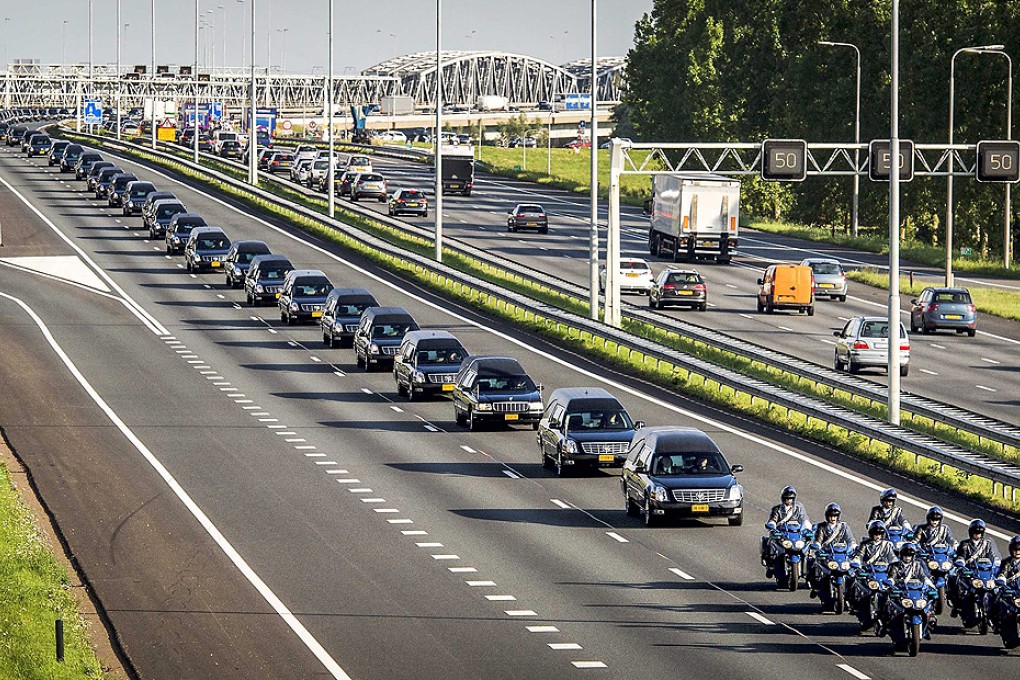 A convoy of funeral hearses carrying the remains of the victims of the MH17 plane crash is driven from the airbase in Eindhoven to Hilversum, the Netherlands, on Thursday. Two more planes carrying bodies are scheduled to arrive on Friday. Photo: EPA
