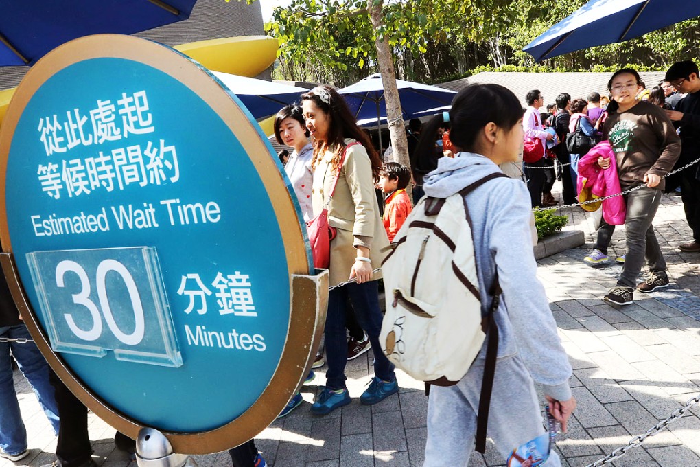 Tourists waiting in line for the Grand Aquarium. Photo: David Wong