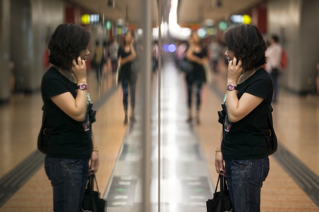 Hong Kong is ranked second in the world for mobile cellular subscriptions for every 100 people. Photo: Bloomberg