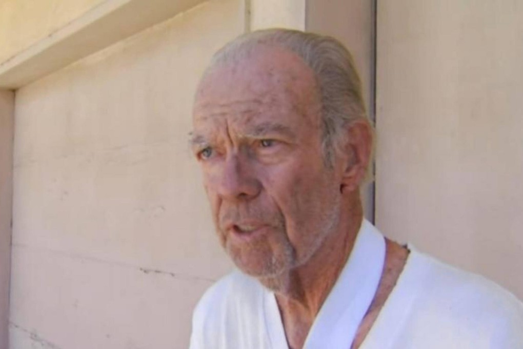 Tom Greer shot the burglar twice in the back.