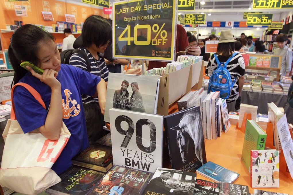 Book exhibitors reduce prices on the last day of Hong Kong Book Fair.