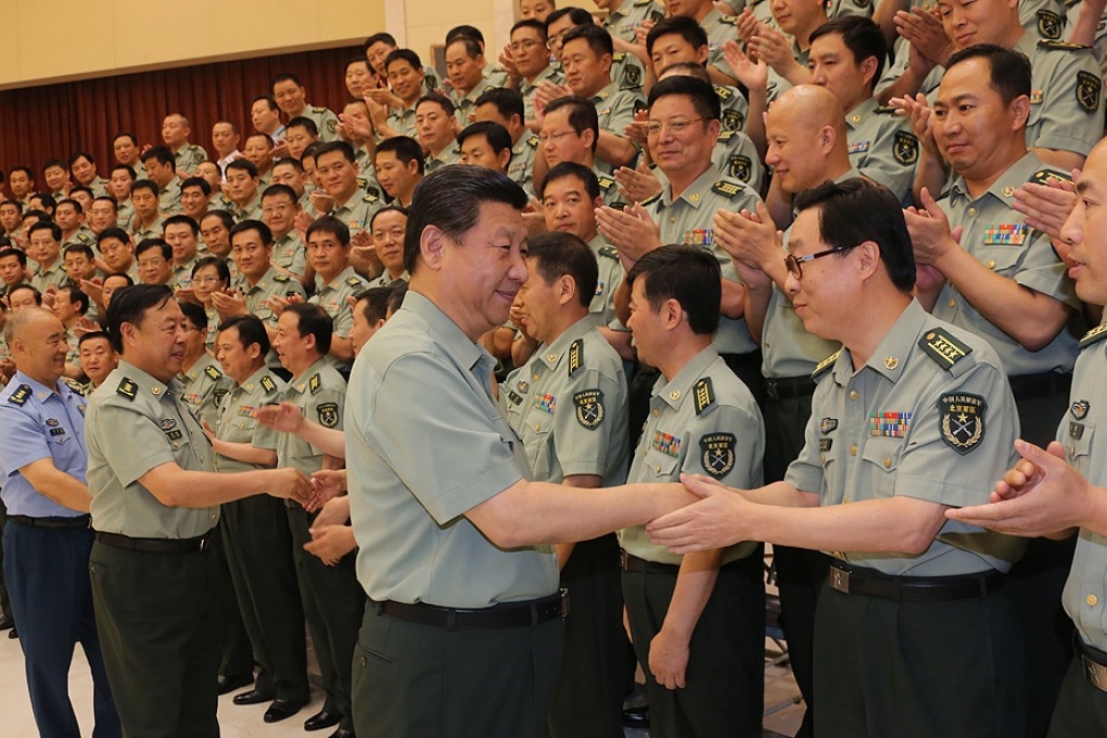 President Xi Jinping shakes hands with military cadre during a tour of the Beijing Military Area Command in July, 2013. Photo: Xinhua