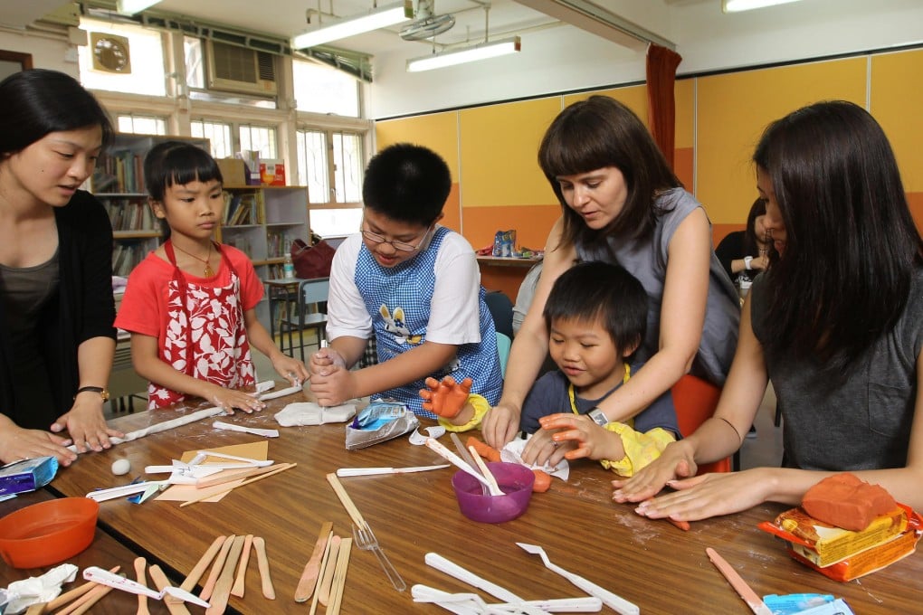 Liesbeth Avern-Briers, second from right, with volunteers and children at a Make It Better workshop in Sham Shui Po. Photo: Edward Wong