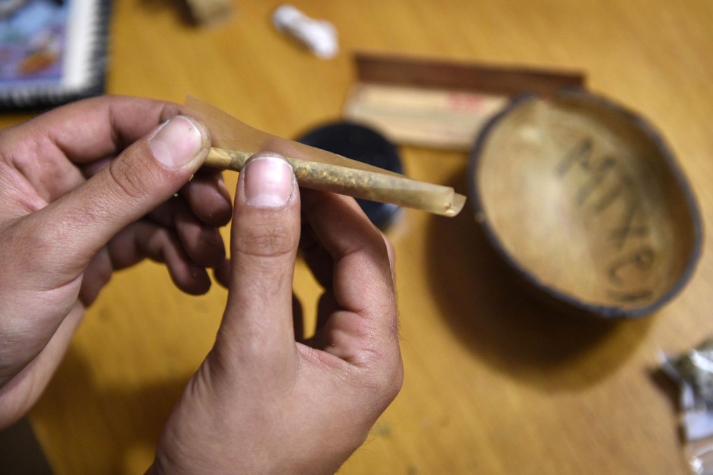 Rolling a joint in a Barcelona smokers' club. Photo: AFP