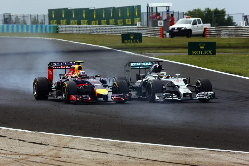Daniel Ricciardo of Red Bull Racing and British driver Lewis Hamilton of Mercedes AMG during the 2014 Hungarian Formula One Grand Prix. Photo: EPA