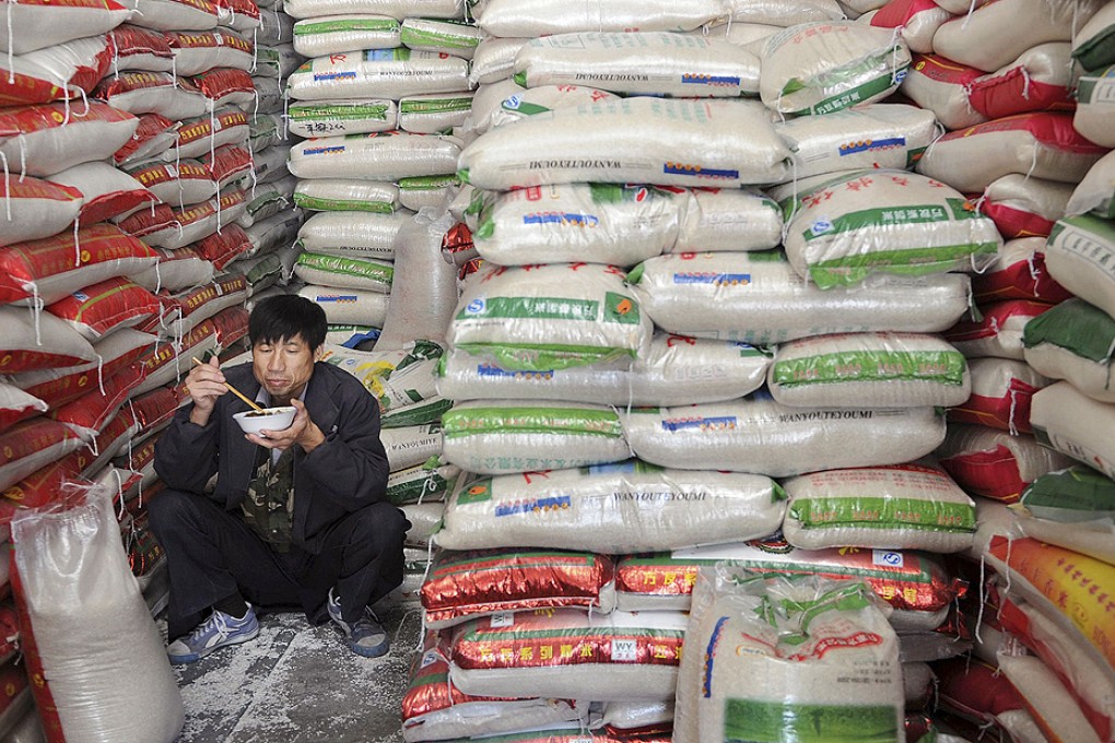 A customer shops for rice at a supermarket in Wuhan. Photo: Reuters