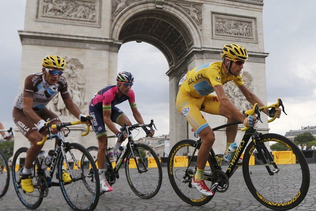 Tour de France winner Vincenzo Nibali of Italy rides near the Arc de Triomphe towards the end of the final stage in Paris. Photo: Reuters