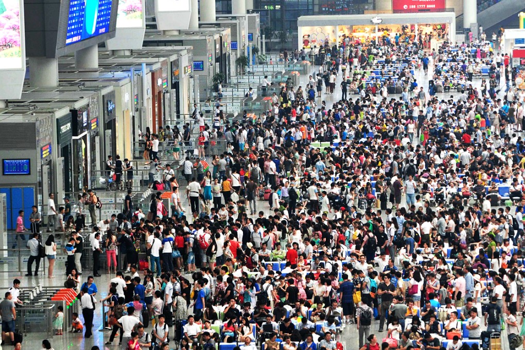 Passengers transferring from the Hongqiao International Airport due to flights delayed or cancelled wait in the waiting hall at the Hongqiao Railway Station in Shanghai, China. Photo: ImagineChina