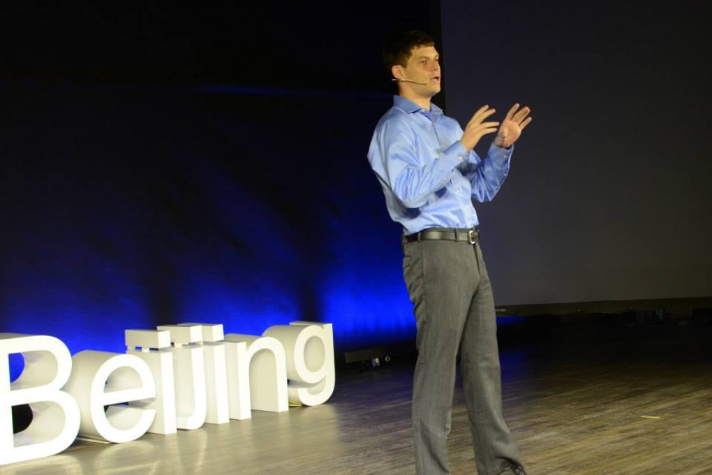 Jesse speaking on the power of humour in Beijing. Photo: Jesse Appell