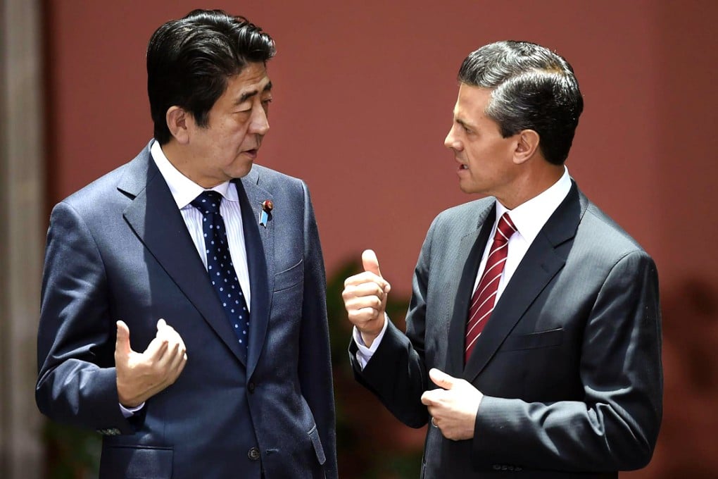 Abe and Pena Nieto praised each other's reforms. Photo: AFP