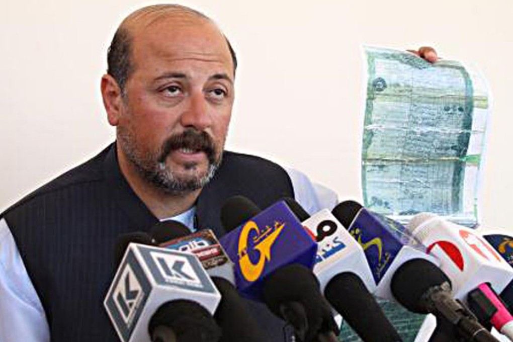 The cousin of outgoing Afghan President Hamid Karzai, Hashmat Karzai, speaks during a press conference in Kanadahar in 2012. Photo: AFP