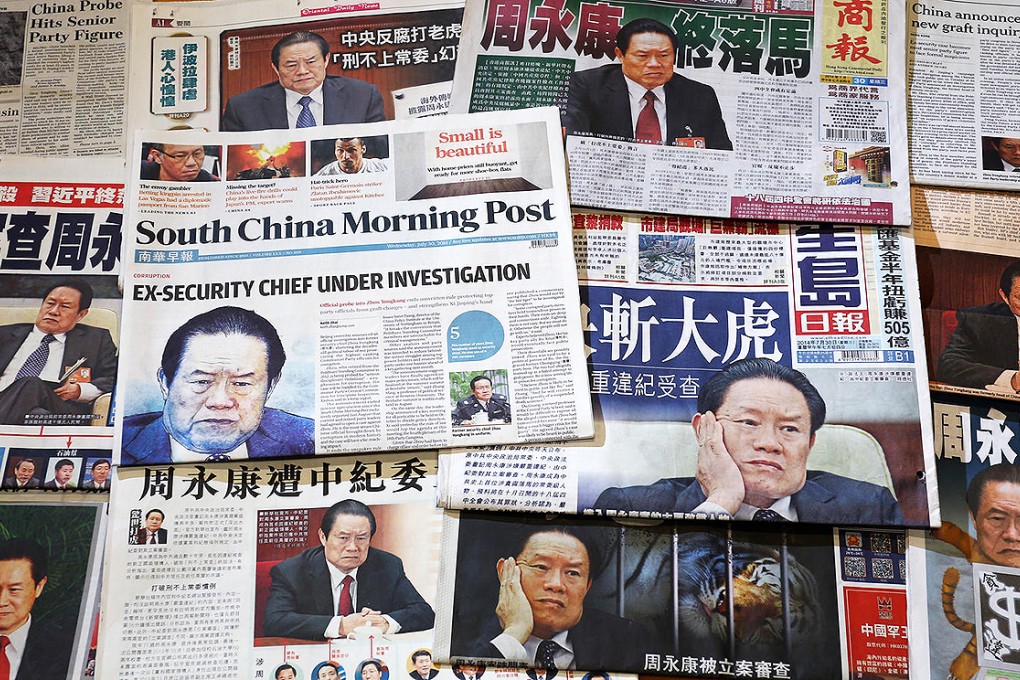 Newspapers across the world have been gripped by the corruption investigation into former security chief Zhou Yongkang. Photo: Nora Tam