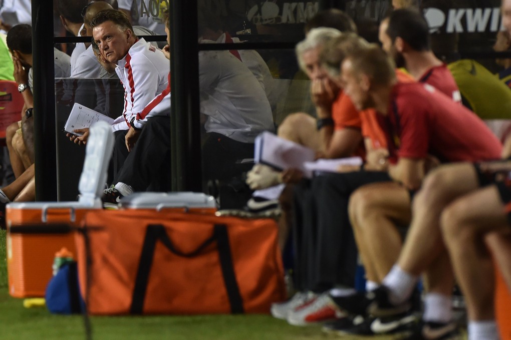Manchester United manager Louis van Gaal watches his team play Inter Milan. Photo: AFP