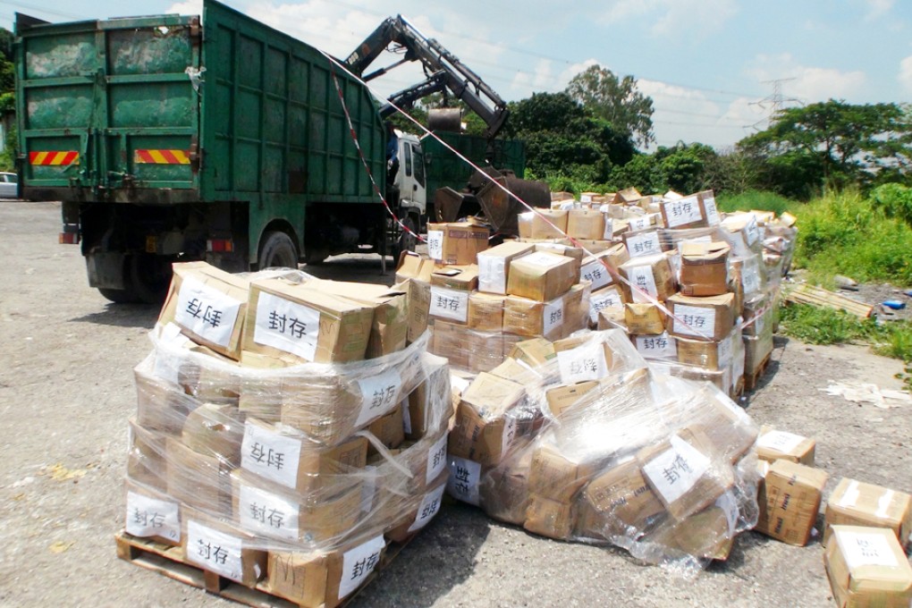 Some 1,000 boxes of food supplied to McDonald's by Husi await collection at a car park on Tong Hang Road, Tuen Mun, yesterday. Photo: SCMP Pictures