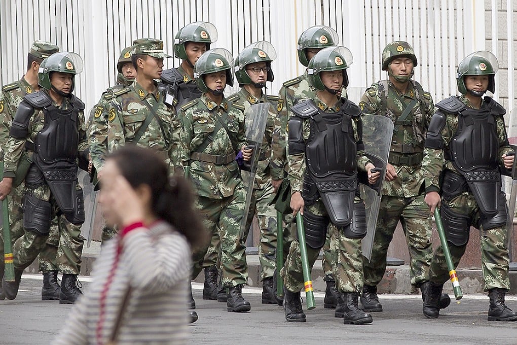 Police patrol in Urumqi in the wake of recent terror attacks. Photo: AP