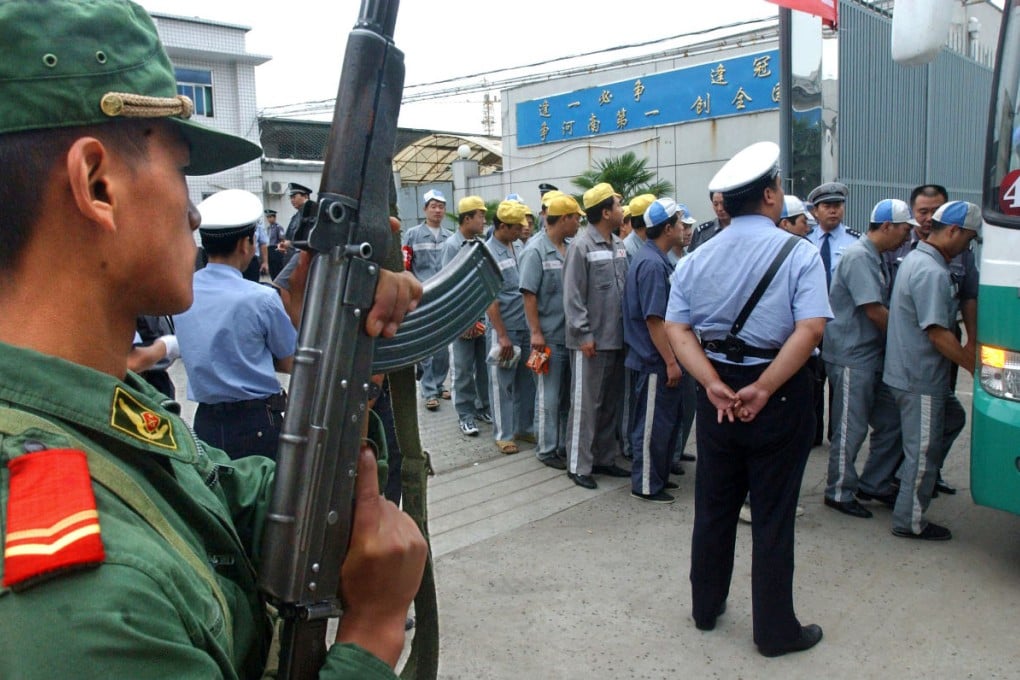 Inmates line up at a prison in Henan province. Beijing has denied harvesting organs without prisoners' consent. Photo: AFP