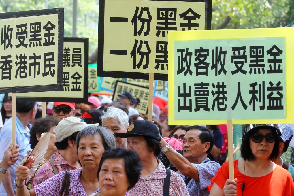 Protesters march to ICAC headquarters from Causeway Bay demanding an investigation into the pan-democrats' donations. Photo: May Tse
