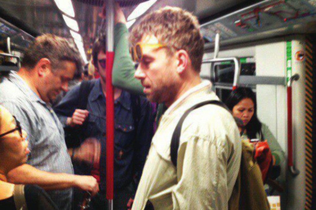 Damon Albarn is spotted on the MTR in 2013. Graham Coxon can be seen in the background in purple glasses. Photo: Marian Joy Hernandez