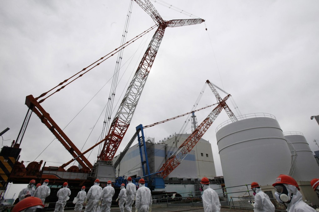 Tepco staff at the Fukushima plant this year. Photo: AP