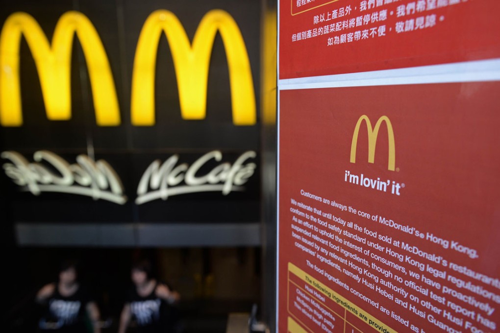 A notice informing customers of the quality of food products is displayed outside a McDonald's fastfood restaurant.
