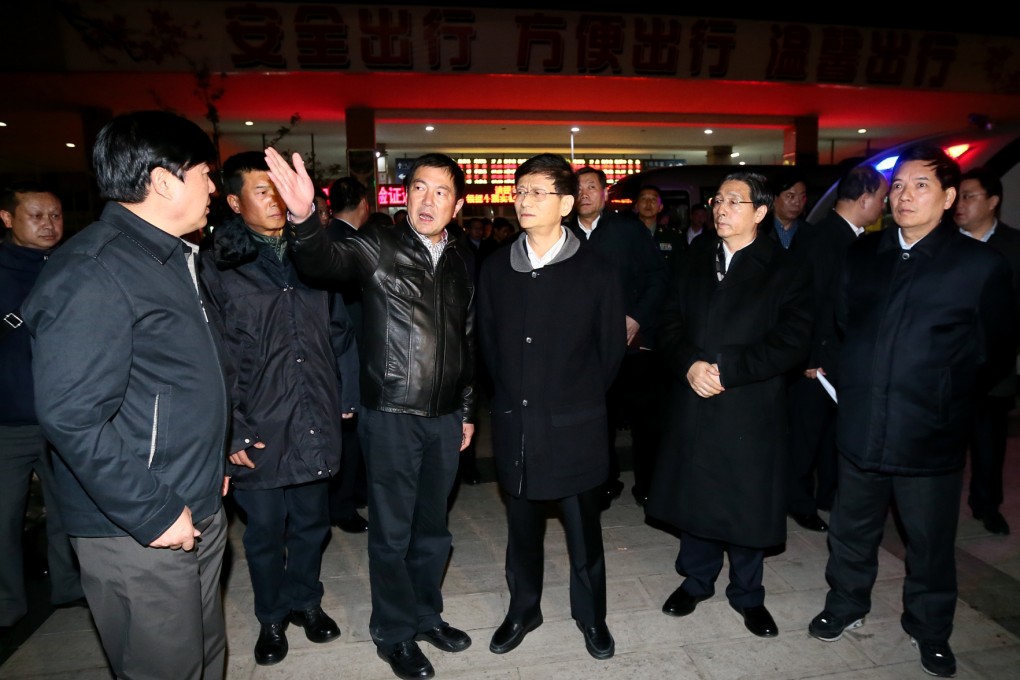 Meng Jianzhu (centre)  head of the Central Commission for Political and Legal Affairs, seen earlier this year at the Kunming Railway Station, said officials should learn from the investigation of Zhou Yongkang. Photo: Xinhua