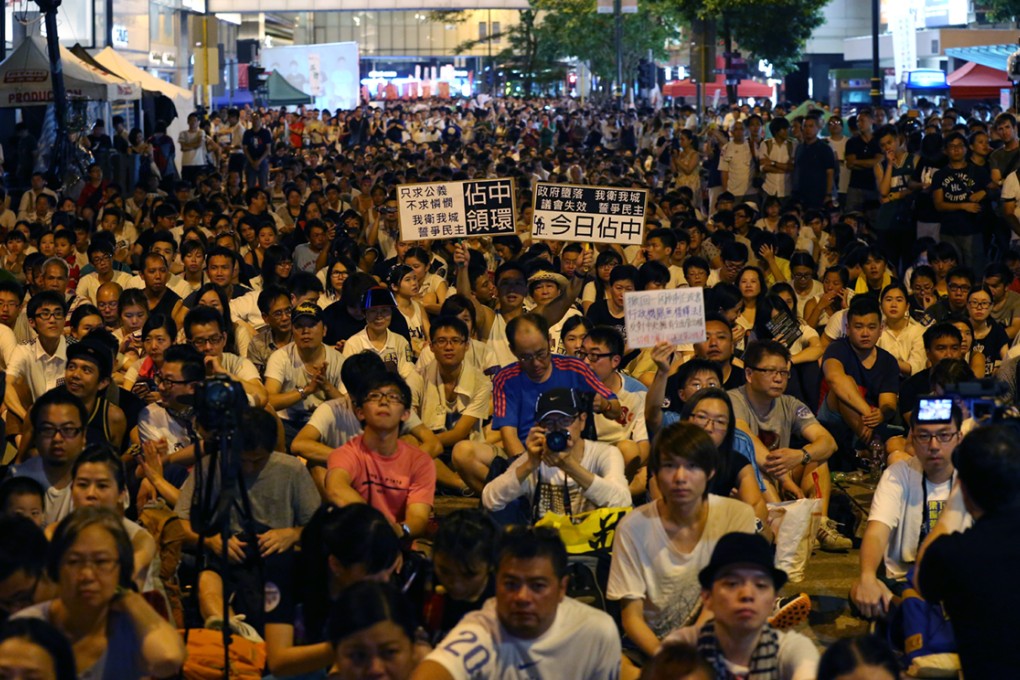 Protesters sit in after July 1 rally at Chater Road in Central. Photo: Nora Tam