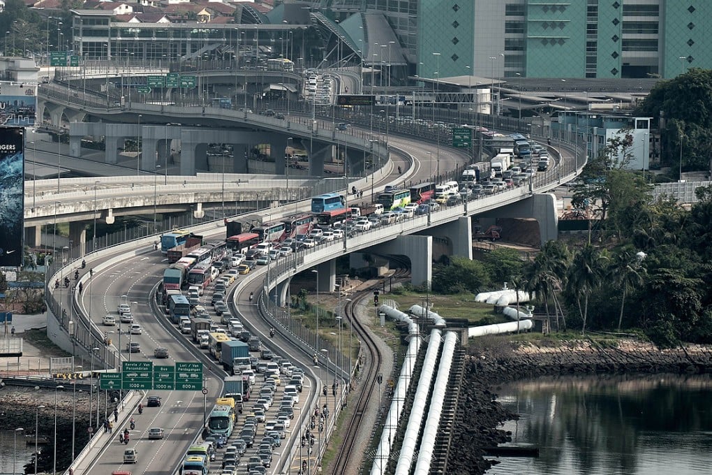 A massive jam disrupts traffic travelling into Singapore from Malaysia at the Johor Bahru checkpoint. Photo: AFP
