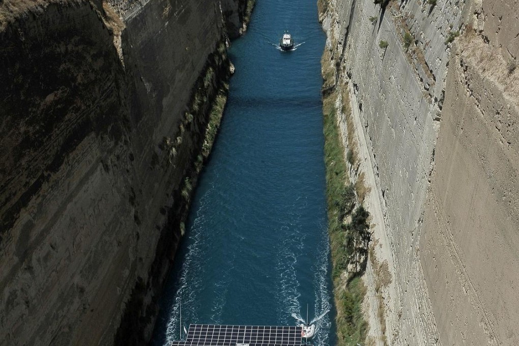 The PlanetSolar passes through the Corinth canal. Photo: EPA