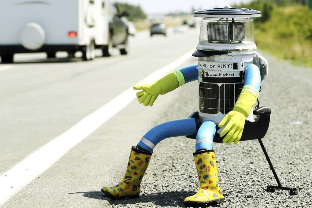 The robot named hitchBOT sits on the shoulder of a road outside Halifax to begin its 6,000km cross-country journey. Photo: Reuters