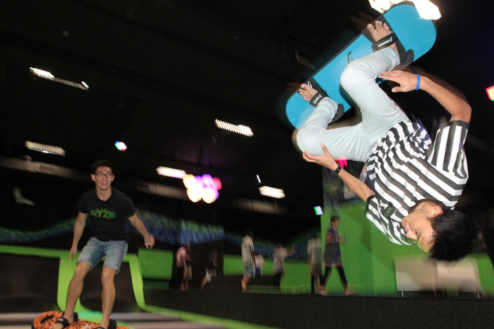 Young Hongkongers try some moves at Ryze, a trampoline park in Quarry Bay that is becoming quite a hot spot. Photo: Bruce Yan