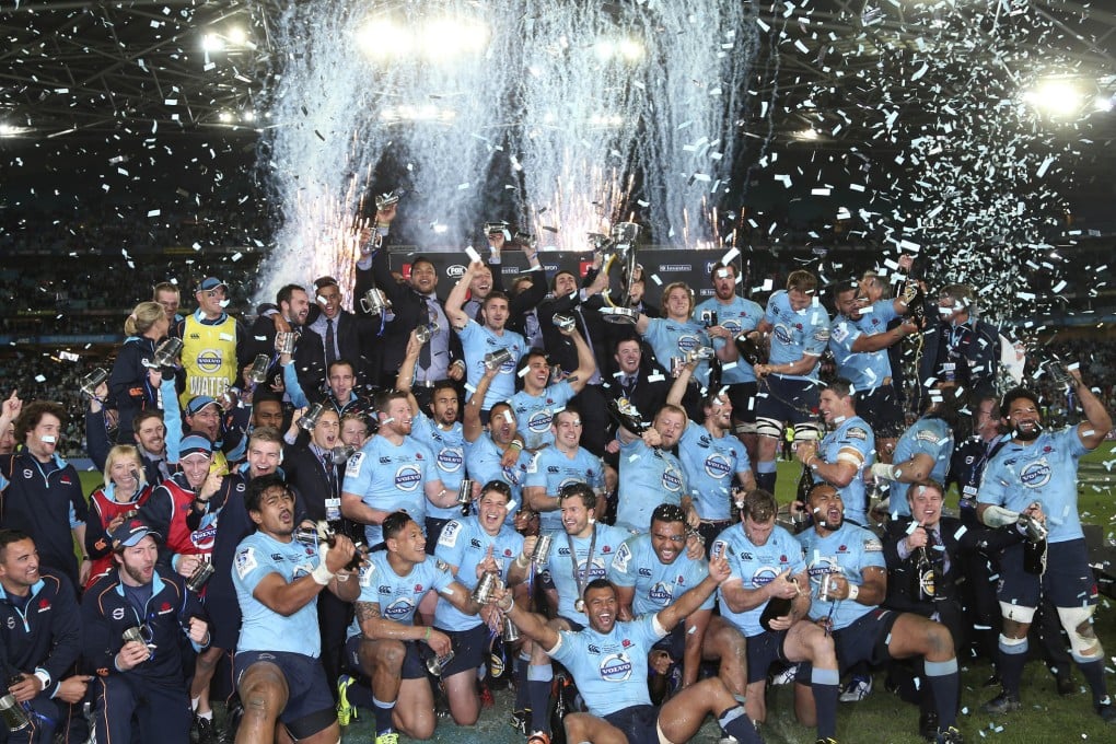 The Waratahs celebrate after defeating the Crusaders 33-32 in the Super Rugby final in Sydney. Photo: AP