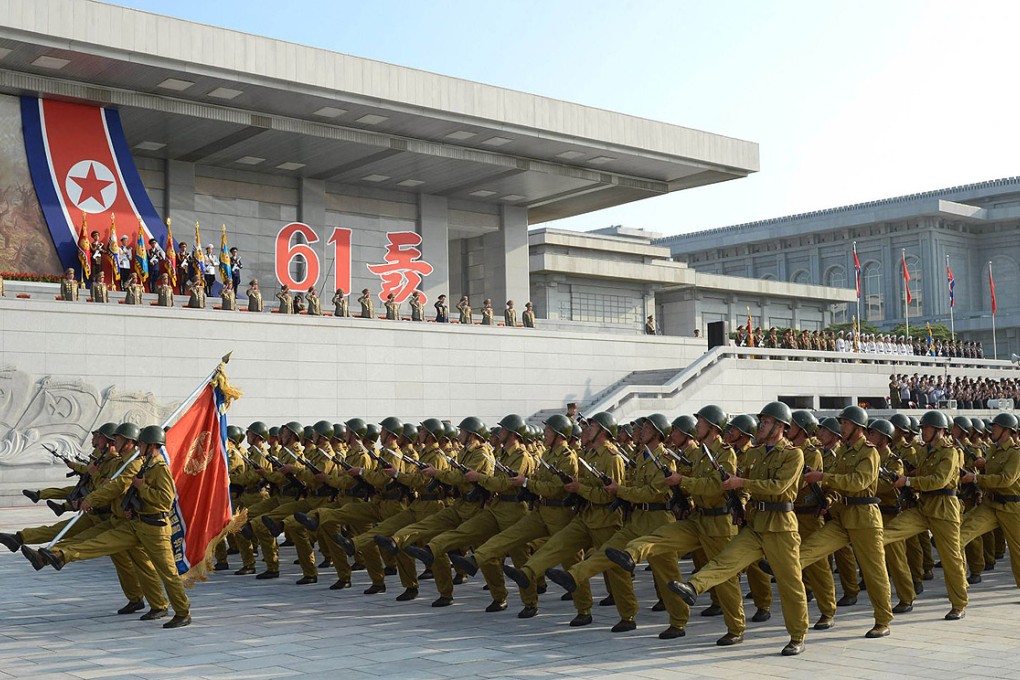 North Korean Army troops march by Kumsusan Palace of the Sun in Pyongyang. Photo: AFP